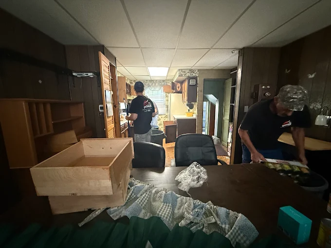 Junk Out NY crew clearing out a cluttered Rochester home interior